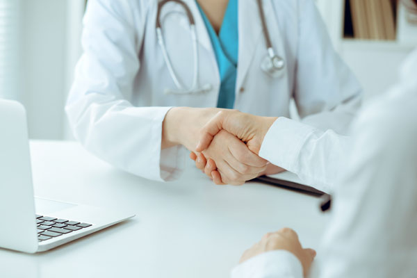 Doctor shaking hands with patient in Chester clinic
